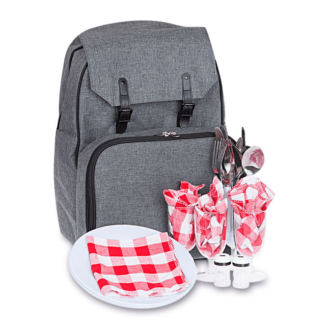 A grey backpack with cutlery, glasses, a plate, and checkered napkins displayed in front.