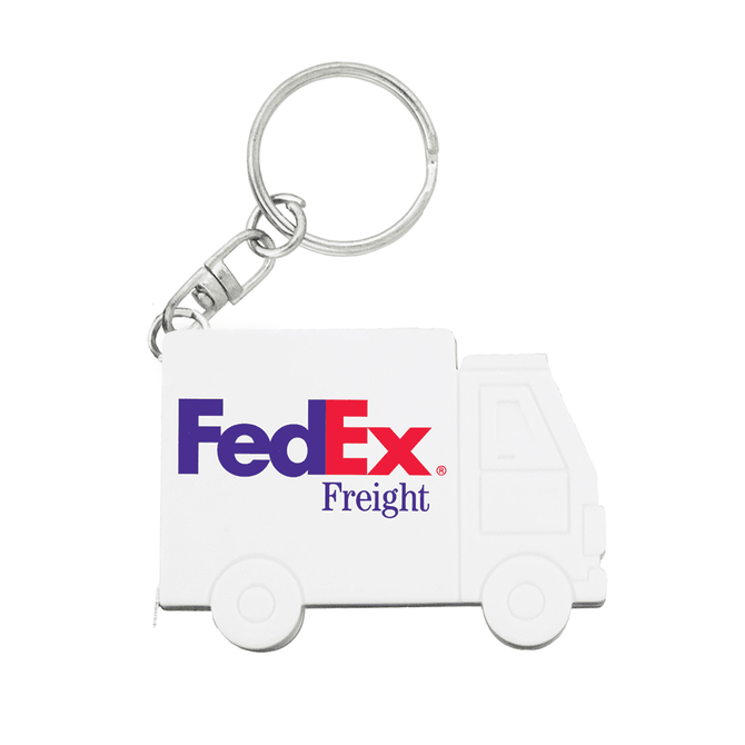 A white truck-shaped keychain with a logo, featuring two wheels and a keyring attachment.