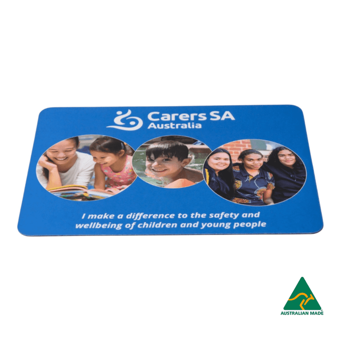 A blue mouse mat featuring three circular images of children and a logo, promoting safety and wellbeing.