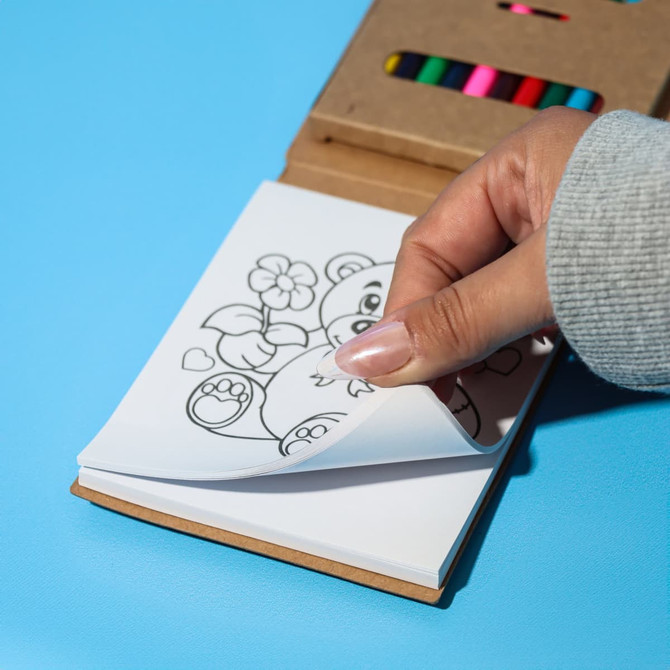 A notepad with pre-printed colouring pages and a wooden cover, accompanied by colourful felt-tip pens.