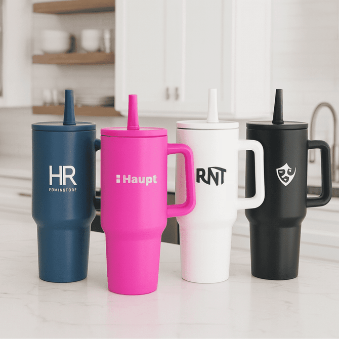 A drink bottle collection featuring four tumblers: navy, pink, white, and black, each with a logo.