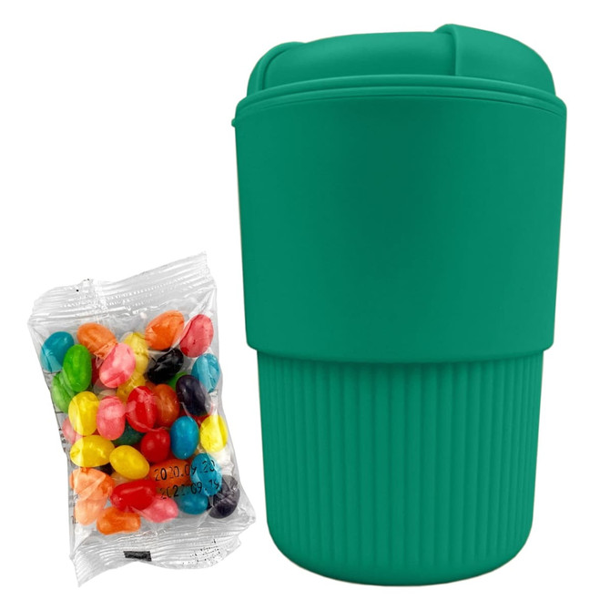 A reusable coffee cup in teal, accompanied by a pack of colourful jelly beans, featuring a textured surface and a lid.