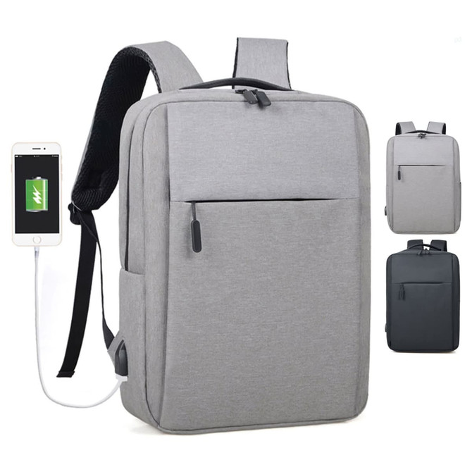 A grey backpack with a front pocket, featuring a USB charging port and black straps, with a logo on the side.