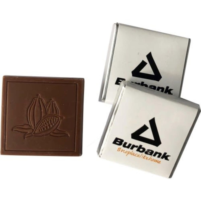 Neopolitan Chocolate squares with a cocoa pod design, featuring a white and silver branded wrapper.