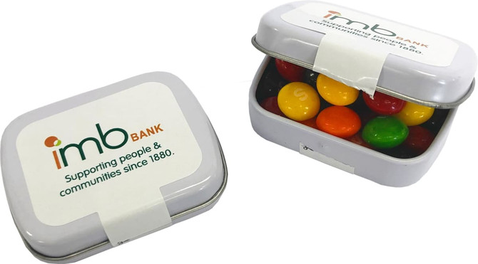 A small silver rectangle tin filled with assorted jelly beans in various colours, featuring a logo on the lid.