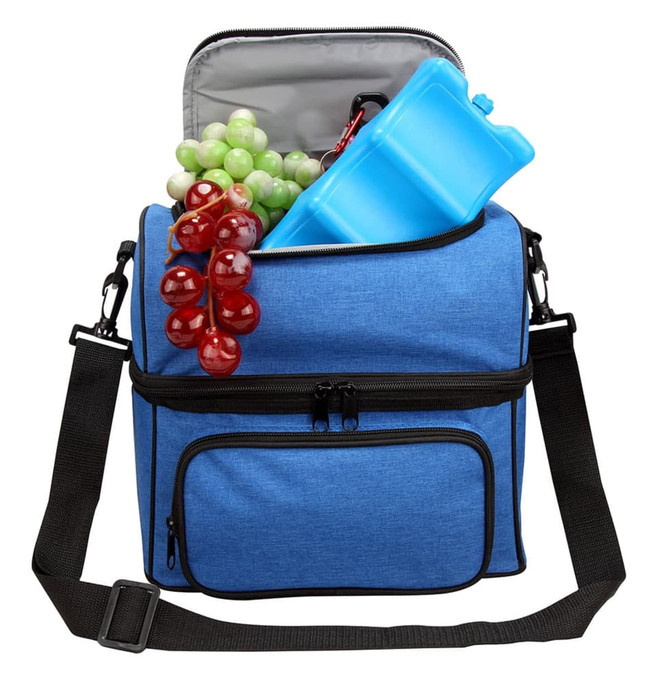 A blue insulated bag with a grey interior, filled with grapes and a drink bottle. It has a shoulder strap and front pocket.