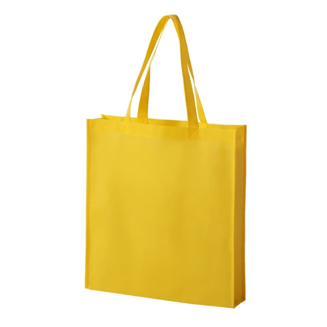 A yellow non-woven tote bag with two handles and no visible branding.