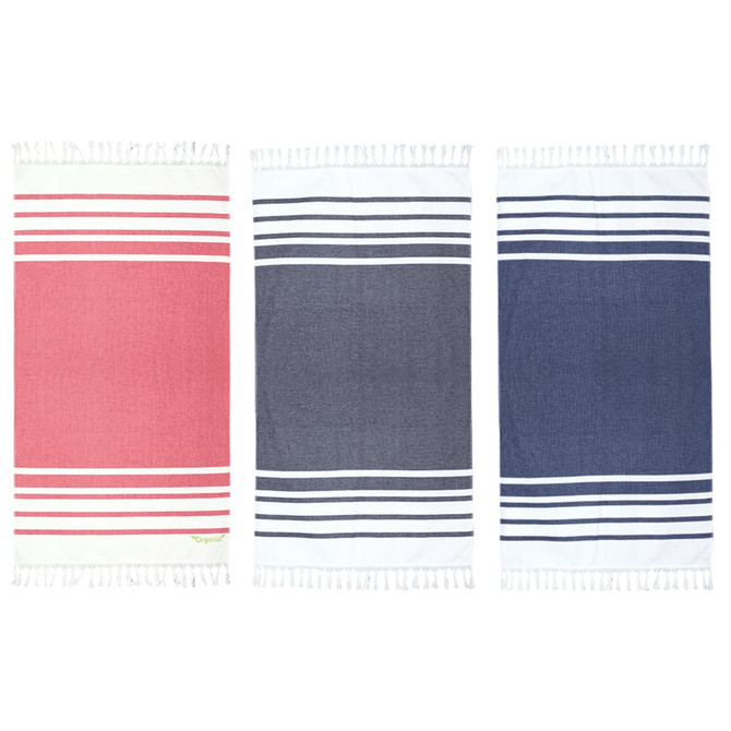 A set of three Trekk Turkish beach towels in red, navy, and dark navy with striped designs and tasselled edges.