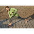 A woman in a green Taza Knit Quarter Zip jumper and grey leggings performs a lunge on a wooden surface.
