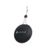 A portable, round black waterproof Bluetooth speaker with a textured surface and a hanging cord. It features a logo.