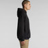 A black hoodie with a loose fit and a front pocket, featuring a hood and long sleeves.