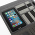A black executive tech compendium featuring a smartphone holder and multiple compartments for cards and documents.