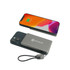 A grey 5000mAh aluminum magnetic power bank is positioned next to a smartphone displaying a battery charge indicator.