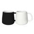 A coffee mug set featuring a black and a white mug, both with a rounded shape and a handle.