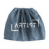 A blue drawstring bag with a logo. The fabric appears soft and slightly crumpled.