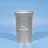 A drink bottle featuring a silver, recycled aluminum cup with a logo on the front against a light blue background.