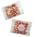 A packet of red and white striped humbug sweets, featuring a clear wrapper and a round label.