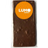 A rectangular chocolate bar in a clear wrapper, featuring a logo. The chocolate has a brown colour with a textured surface.