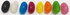 A row of jelly beans in various colours, including black, white, blue, red, yellow, orange, green, and pink.