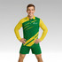 A model wears a green and yellow long-sleeved polo shirt with a logo on the chest, paired with matching shorts.