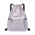 A drawstring backpack in light grey with a textured finish and a front zip pocket. It features adjustable black straps and a logo.