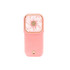 A pink folding neck fan with a structured design and ventilation openings, featuring a small stand at the base.