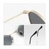 Oval retro sunglasses featuring gold frames and dark lenses, with black temple tips and a small logo on the side.