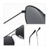 Classic aviator sunglasses with black frames and dark lenses. Features adjustable nose pads and sleek temple arms.
