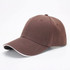 A brown 6-panel cap featuring a curved brim and a contrasting trim, with an inbuilt logo.