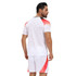 A breathable crew neck raglan tee shirt in white with red and black accents, featuring a logo.