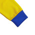 A close-up of a sleeve from a unisex track jacket in bright yellow with a blue cuff. It features a logo.