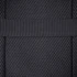 A textured black mesh material with a solid black strap, suitable for a backpack design.