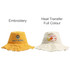 A yellow bucket hat with embroidery and a cream bucket hat featuring a logo. Both have a raw edge design.