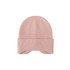 A pink earflap beanie with ribbed texture and a folded cuff. It features a logo on the side.