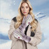 Ski gloves in light purple with a logo, worn by a model against a snowy background.