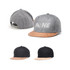 A flat cork snapback cap with a grey body, a cork brim, and additional black and dark grey variations.