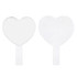 A heart-shaped handheld mirror with a transparent handle, featuring a smooth, reflective surface.