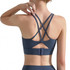 A women's navy cross back yoga crop bra tank with multi-strapped back design and adjustable closure.