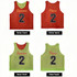 A reversible training bib in red and green, featuring the numbers '2' and branding on both sides.