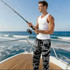 Men's breathable quick-drying fishing pants in camouflage, paired with a white tank top, worn by a man fishing on a boat.