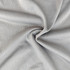 A close-up view of soft, breathable fabric in grey with a mesh texture, ideal for clothing.