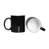 A coffee mug in black with a glossy finish and a contrasting white interior. It features a handle and includes a logo.