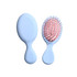 A light blue mini paddle brush with a pink bristle head, featuring a logo on the handle.