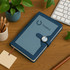 A5 magnetic buckle pocket notebook in blue with a logo, placed on a wooden desk alongside plants and stationery.