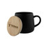 A black coffee mug with a wooden lid and a logo on the side.