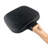 A square grill pan with a non-stick black surface and a wooden handle. It features a textured pattern on the base.