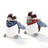 Two plush Kookaburra toys with brown and white fur, one wearing a blue bandana and the other with a red bandana, each having a logo.