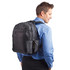 A black laptop backpack with multiple compartments is worn by a man in a blue shirt. The bag features a logo.