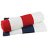 A striped towel featuring red, white, and navy blue stripes, folded neatly. Branding is present on the towel.