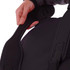 A person holds the padded handle of a black duffle bag featuring a logo. The bag has a sleek design.
